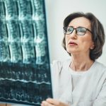 Serious female vertebrologist focused on her work